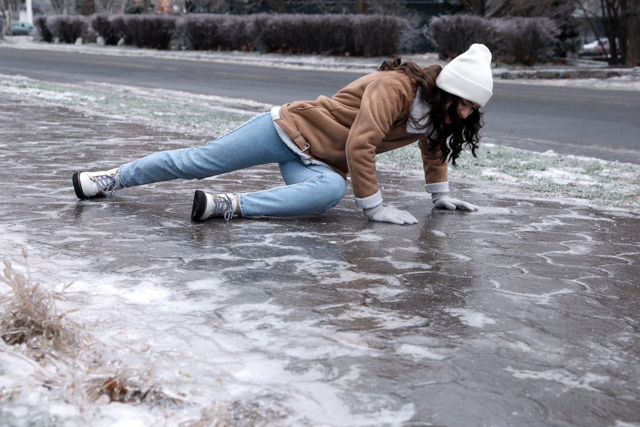Woman lying on ice after slip and fall accident