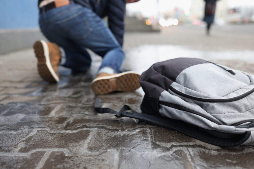Man standing up after a slip and fall accident