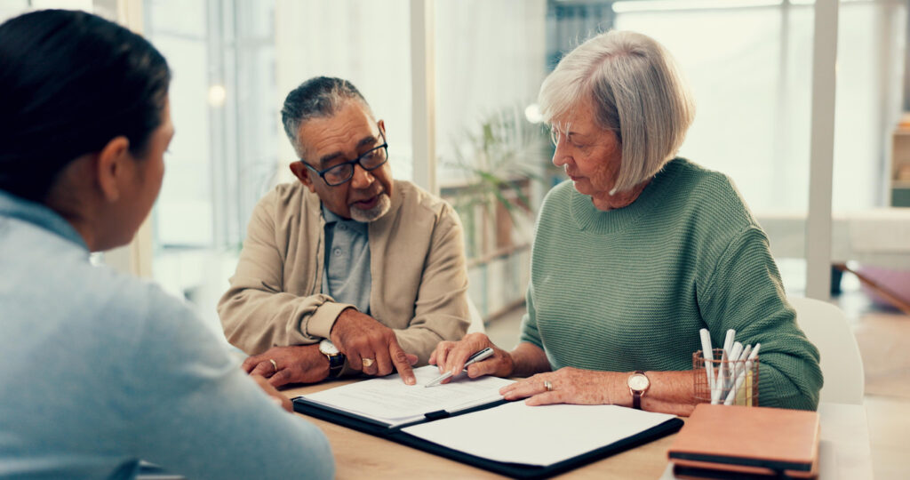 couple signing estate documents